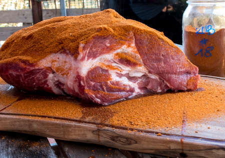Dust the pork with a mixture of spices to prepare the pulled pork