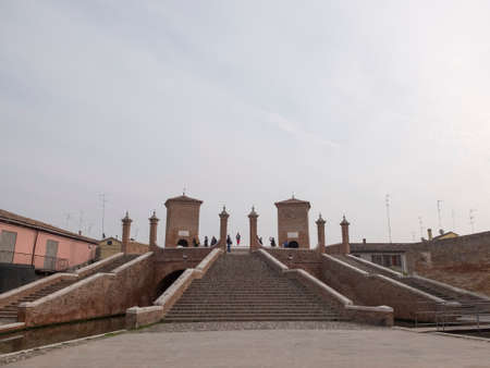 Comacchio, FE, Italy - November 4, 2017: Bridge of Trepponti or Ponte Pallotta, prospective view of the famous bridge over the canal that crosses the city.のeditorial素材