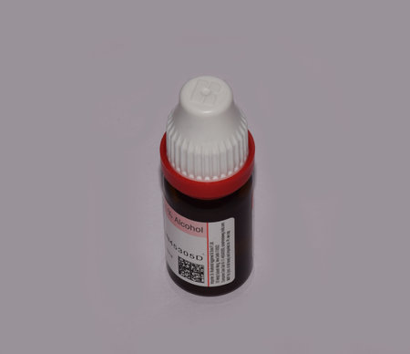 Glass Bottle of a Homeopathic Medicine isolated in light grey backgroundのeditorial素材