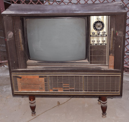 Vintage old black and white tv on stand, Retro television with wood caseのeditorial素材