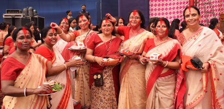 Indian Bengali women playing with Vermilion also known as Sindoor Khela in Bengali during Durga Puja Festivalのeditorial素材