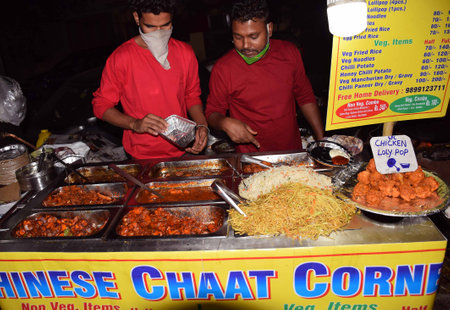 Delhi - India
25th Oct 2020
Front angle shot of Indian street vendors delivering Chinese food itemsのeditorial素材