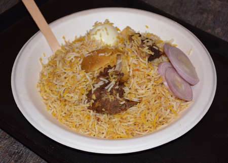 Delicious Indian Mutton Biryani served in a white paper plateの写真素材