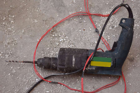 Side angle shot of a drilling machine lying at a construction siteの写真素材