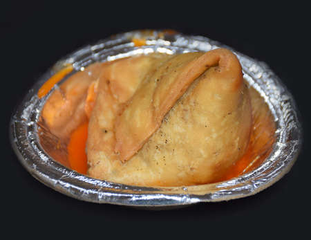 Close up of Indian Samosa served on a paper plateの写真素材