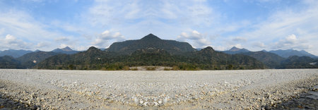 Picture of a hill with clouds surrounded it . Beautiful Landscapeの写真素材