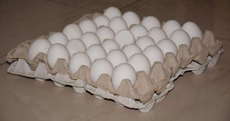White Chicken eggs on a tray or crateの写真素材