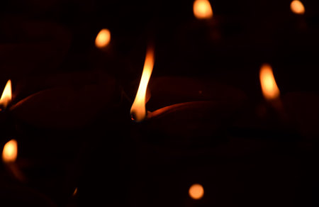 Low light shot of Diya or earthen lamp illuminated during Diwali festival in Indiaの写真素材