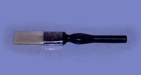 A paint brush used for painting Window and Door grills is kept on a tableの写真素材
