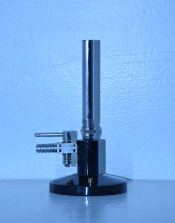 Bunsen Burner is a device for combining a flammable gas with controlled amounts of air before ignition. Many types of gases can be used in it such as methane, butane, propaneの写真素材