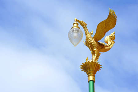 Golden swan in Thai street lampの写真素材
