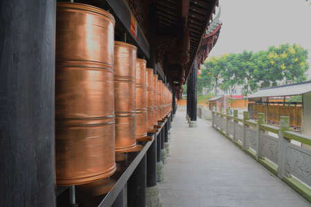Close up to prayer's wheel in a templeの写真素材