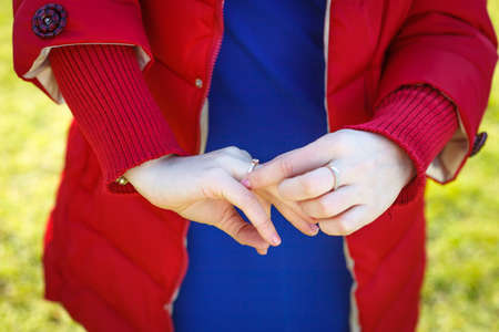Girl admire a ring on her handの写真素材