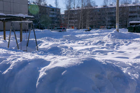 Winter snowy road in the village in russiaの写真素材