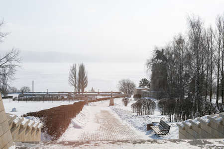 Beautiful embankment of river in winter in sunの写真素材