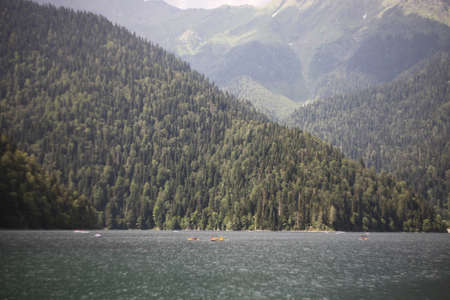 Beautiful lake with forest and mountains on backgroundの写真素材