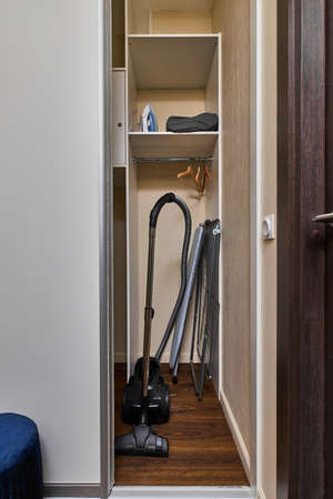 Photo of the closet with vacuum cleaner insideの写真素材