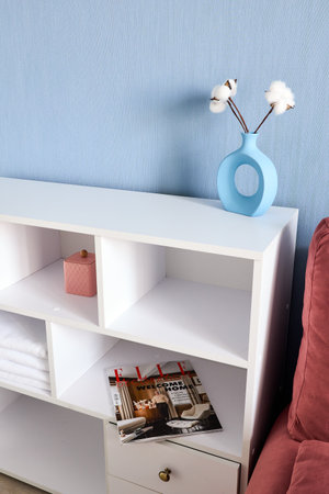 Stylish studio apartment interior with comfortable beige sofaの写真素材