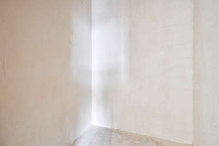 Interior of new apartment without finishing in gray tones