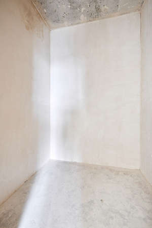 Interior of new apartment without finishing in gray tonesの写真素材