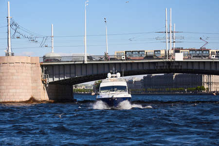 Photo of a yacht sailing on the river