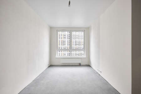 Interior of new apartment without finishing in gray tonesの写真素材