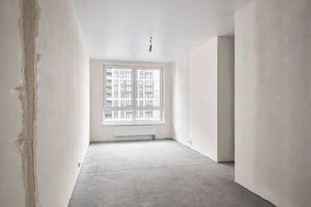 Interior of new apartment without finishing in gray tones