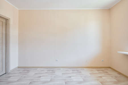 Photo of an empty room before the sale