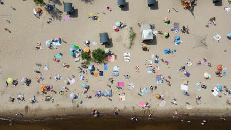 Drone photo of people resting on beachの写真素材