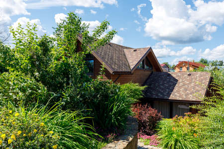 Photo of a chic country house on a sunny day