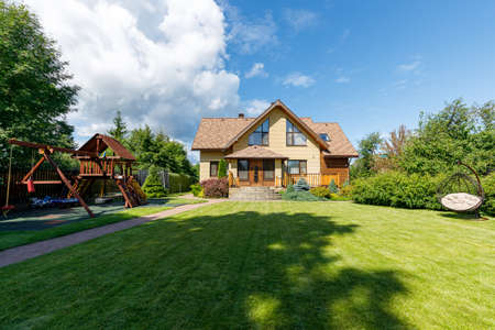 Photo of a chic country house on a sunny dayの写真素材