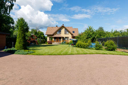 Photo of a chic country house on a sunny dayの写真素材