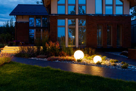 Photo of lighting in the evening gardenの写真素材