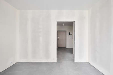 Interior of new apartment without finishing in gray tones