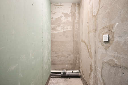 Interior of new apartment without finishing in gray tonesの写真素材