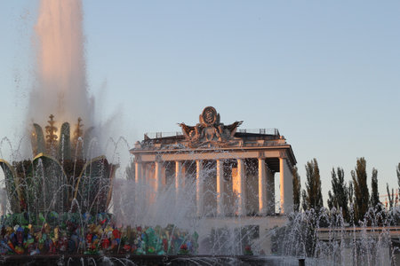 A Stunning Colorful Fountain Display at Night Set Against a Majestic Historic Backgroundの写真素材