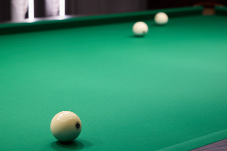 A Focused Shot of Colorful Billiard Balls Set Up Neatly on a Green Felt Pool Table