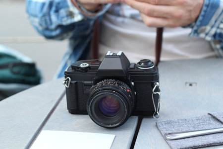 A Classic Camera Positioned on a Table Perfectly Capturing Moments with Timeless Styleの写真素材