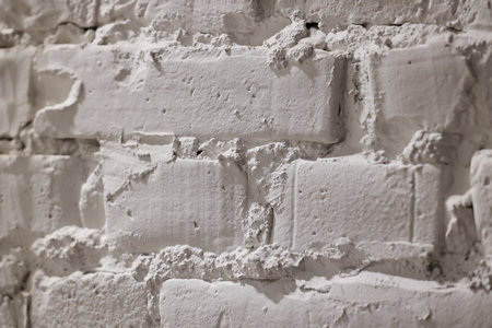 Closeup view of a beautifully Textured White Brick Wall showcasing its unique surface designの写真素材