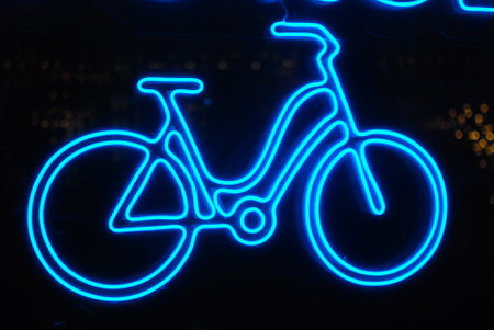 Art Display Featuring a Blue Neon Bicycle Sign that Captures Attention and Ambianceの写真素材