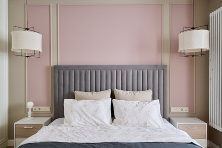 This exquisite, elegant modern bedroom features stylish decor with a soft color paletteの写真素材