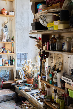 A Creative Workspace Featuring Art Supplies Alongside Endless Inspiration for Artistsの写真素材