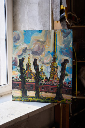 A Vibrant and Colorful Cityscape Featuring Stunning Golden Spires Alongside Lush Treesの写真素材