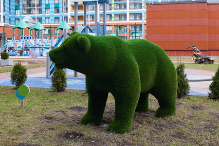 The Green Bear Sculpture located within the Urban Playground invites joy and creativityの写真素材