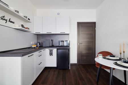 This is a Modern Kitchen Interior that features a Sleek Design along with a Minimalist Aestheticの写真素材