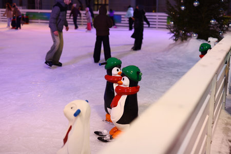 It was a super fun and exciting day at the wonderful ice skating rink filled with cute penguinsの写真素材
