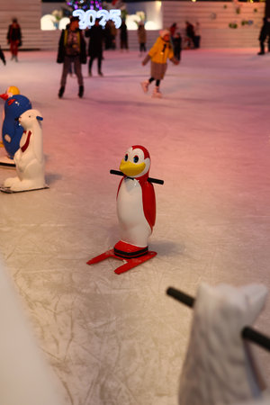 Experience an enchanting Ice Skating Wonderland complete with delightful Penguin Figuresの写真素材