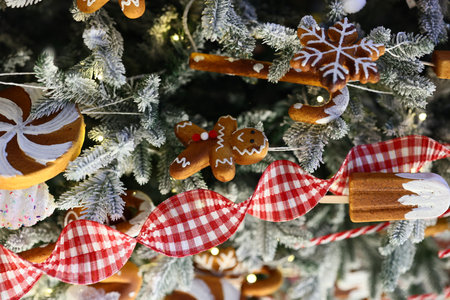 Beautifully Festive Christmas Tree Decorations Featuring Gingerbread and Colorful Candy Canesの写真素材
