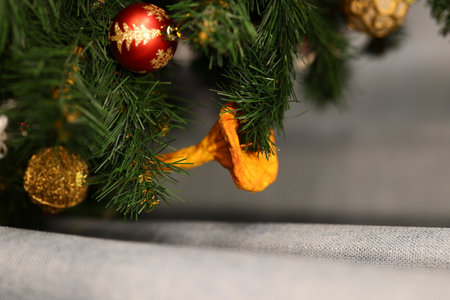 A festive Christmas Tree adorned with colorful ornaments for a joyful holiday celebration