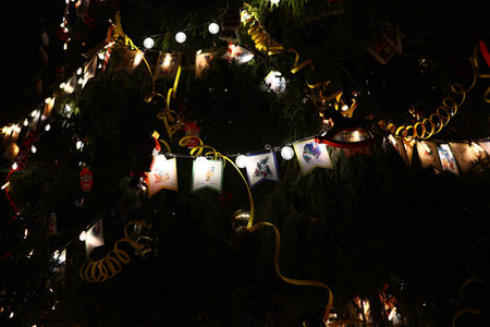 Enjoying the Festival Atmosphere of Beautiful Christmas Tree Decorations at Nightの写真素材